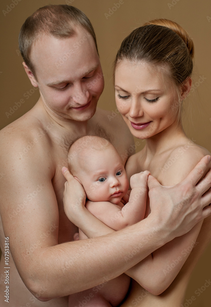 Happy family. Young parents and beautiful newborn son, hug with Happy family. Young parents and beautiful newborn son, hug with