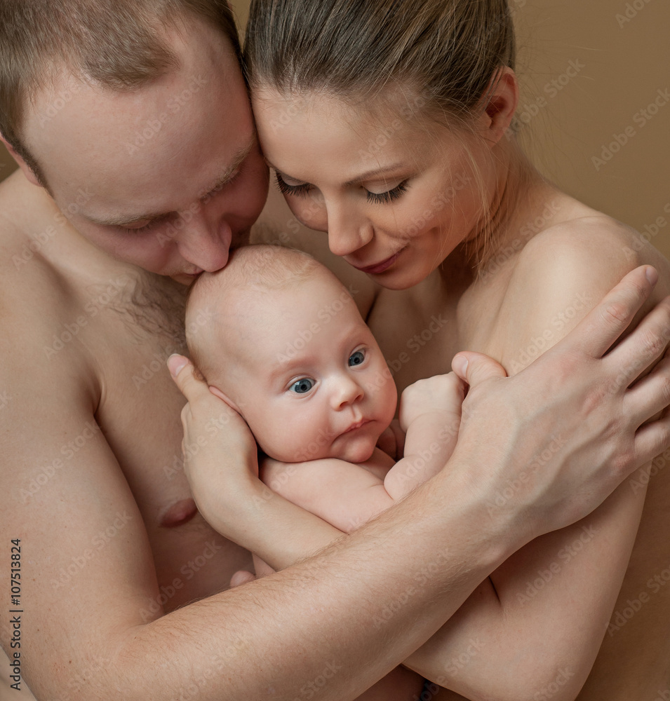 Happy family. Young parents and beautiful newborn son, hug with Happy family. Young parents and beautiful newborn son, hug with