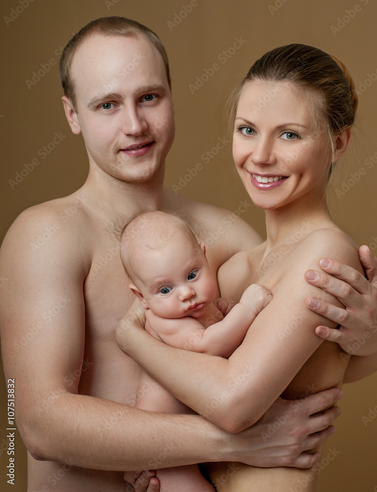 Happy family. Young parents and beautiful newborn son, hug with Happy family. Young parents and beautiful newborn son, hug with