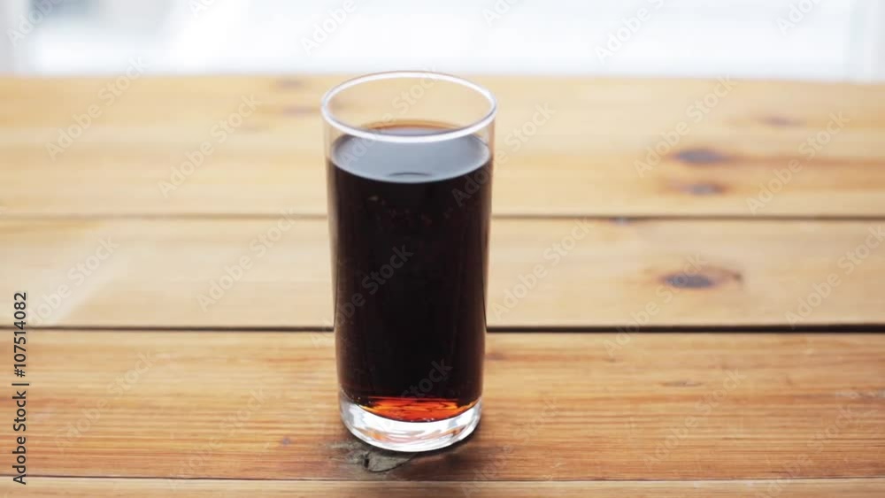 glass of lemonade or soda drink on wooden table glass of lemonade or soda drink on wooden table