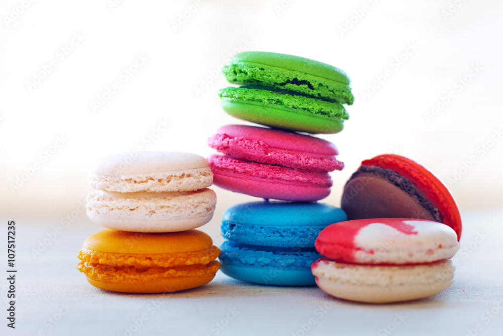 Colorful macaroons tower close-up on whitebackground. Colorful macaroons tower close-up on whitebackground.