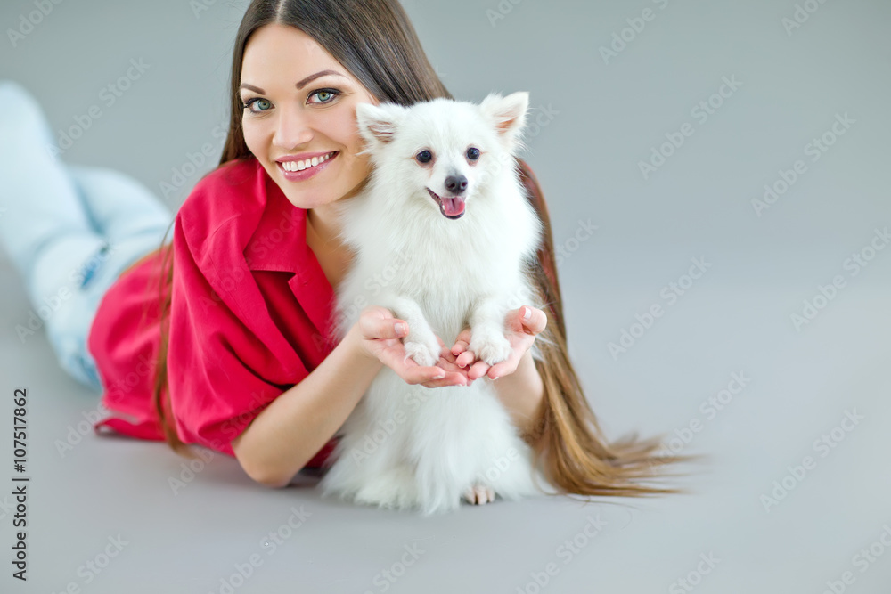 woman with a little white dog, studio woman with a little white dog, studio