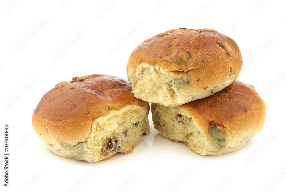 freshly baked traditional dutch raisin buns on a white background freshly baked traditional dutch raisin buns on a white background