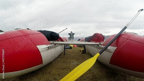 Red Paired Boat With Paddle at Foggy Sky of Highmountains photo