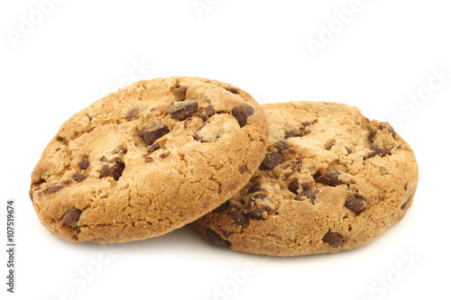 stacked crunchy chocolate chip cookies on a white background