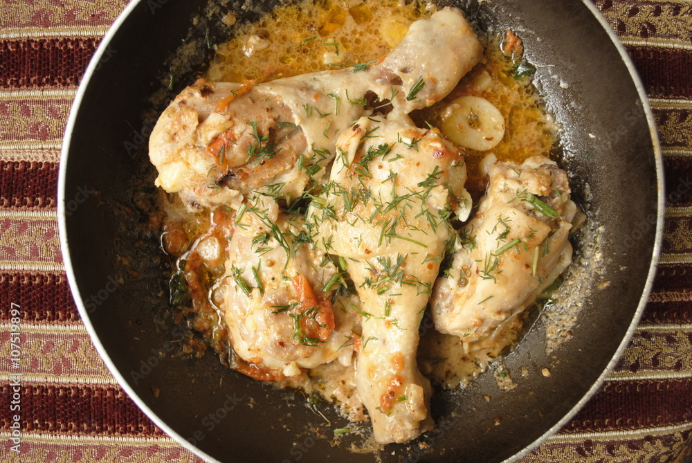 chicken fried with garlic tomatoes and herbs in sauce chicken fried with garlic tomatoes and herbs in sauce