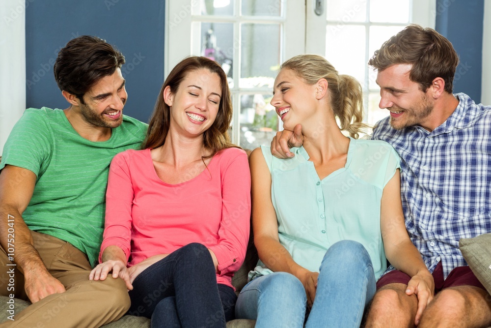 Joyful friends sitting at home Joyful friends sitting at home
