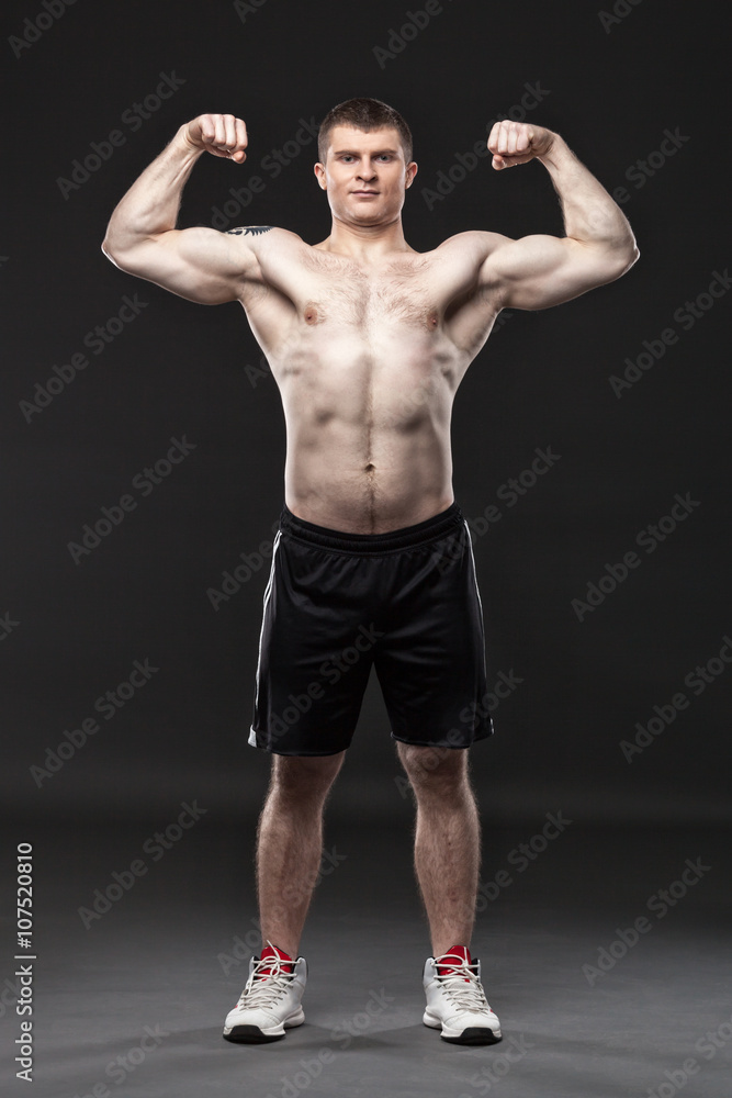 Sporty and healthy man isolated on black background Sporty and healthy man isolated on black background