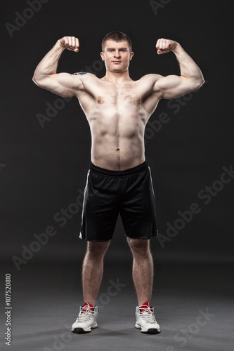 Sporty and healthy man isolated on black background