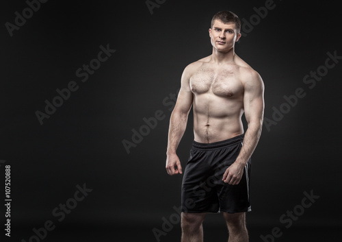 Sporty and healthy man isolated on black background