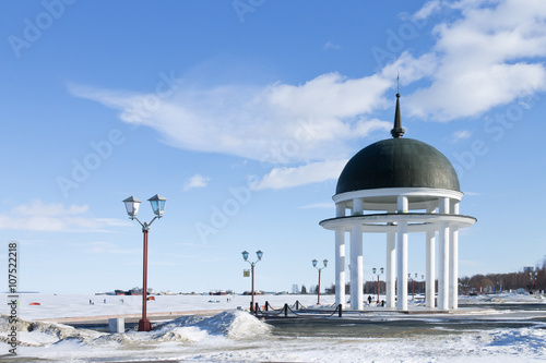 Rotunda on winter embankment on the Onego lake in Petrozavodsk, Russia