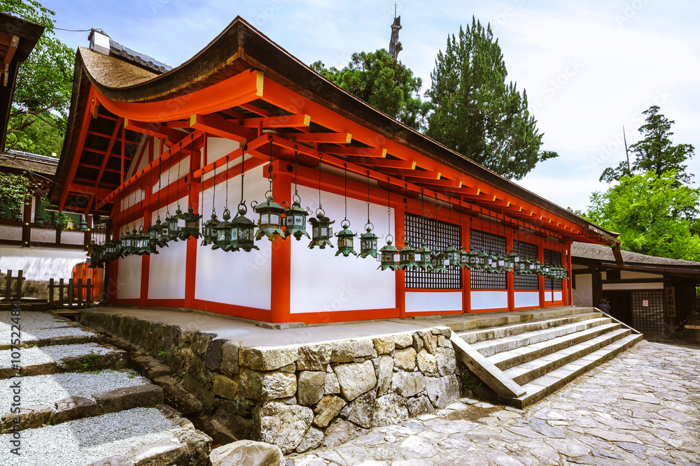 White house with red roof and hanging shrine lanterns at the Kasuga Taisha  Shinto Shrine in Nara, Japan Stock Photo | Adobe Stock