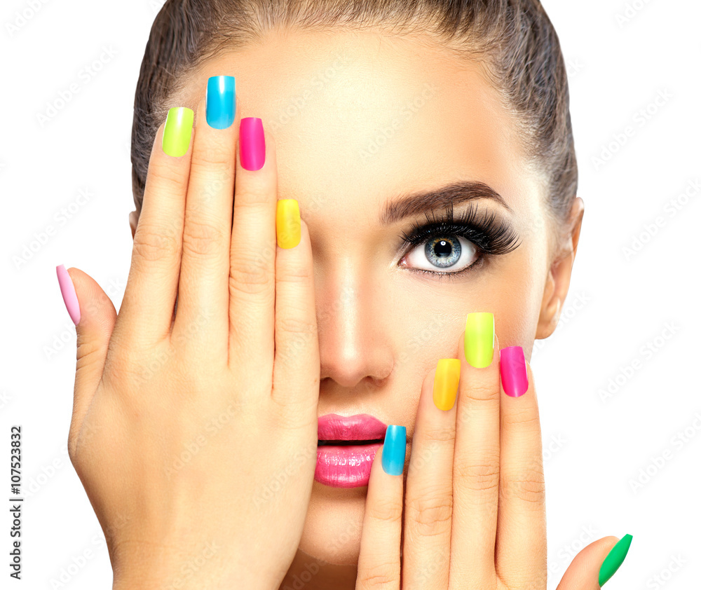 Photo & Art Print Beauty girl face with colorful nail polish
