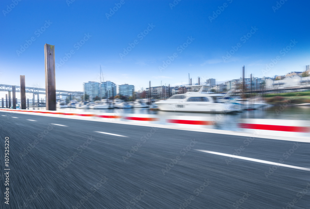 empty road near yacht with cityscape and skyline in portland