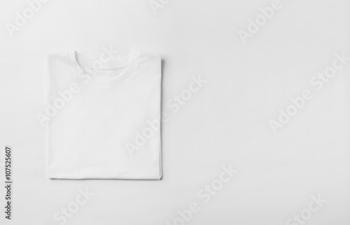 Photo of blank tshirt on white background. Wide © SFIO CRACHO