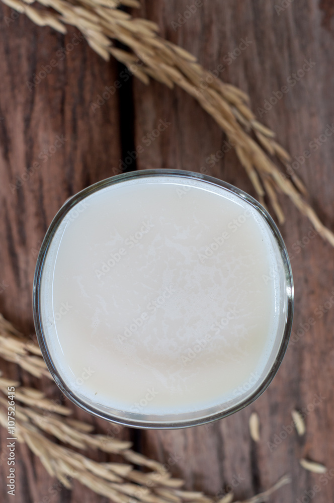 Soy milk in white glass on wooden background Soy milk in white glass on wooden background