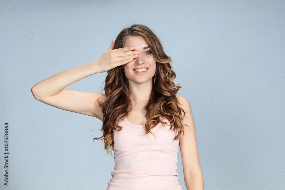 The young woman's portrait with happy emotions The young woman's portrait with happy emotions