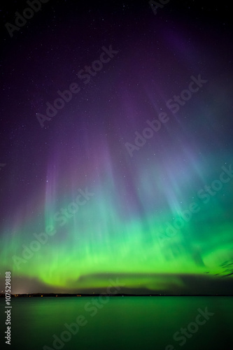 Northern lights over lake in finland