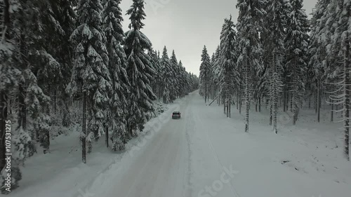 Road in a forest with car,snow photo