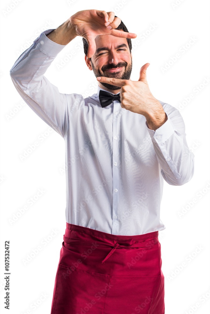 Waiter focusing with his fingers Waiter focusing with his fingers