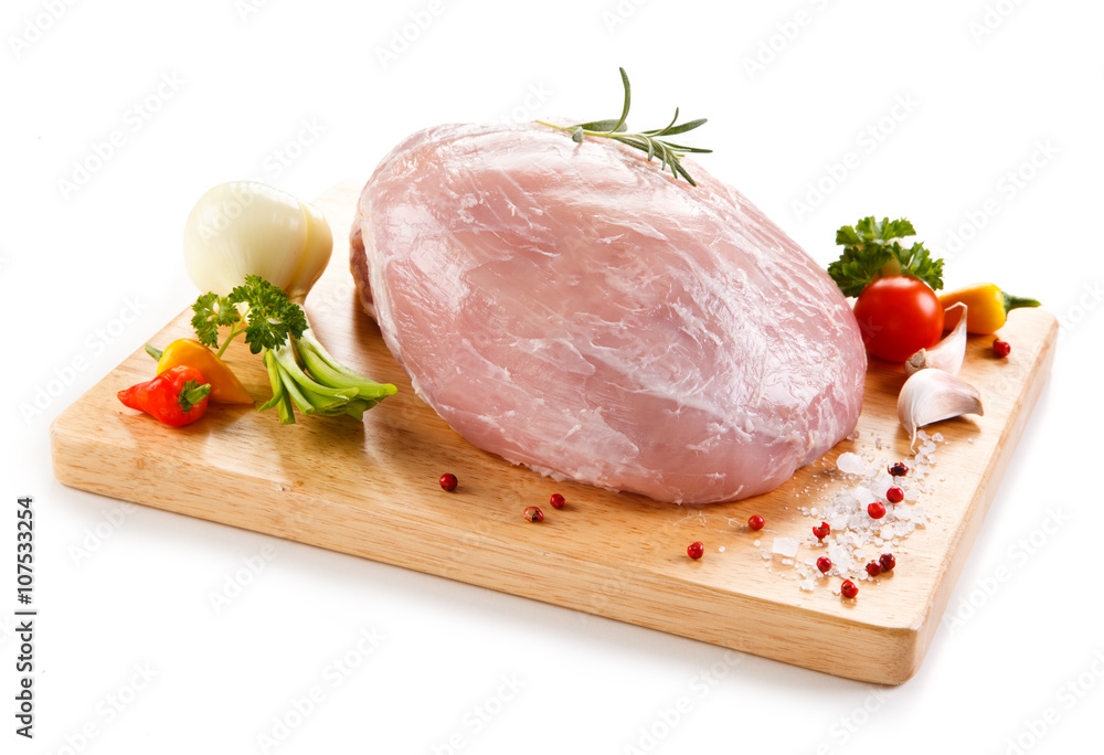 Fresh raw pork on cutting board on white background Fresh raw pork on cutting board on white background