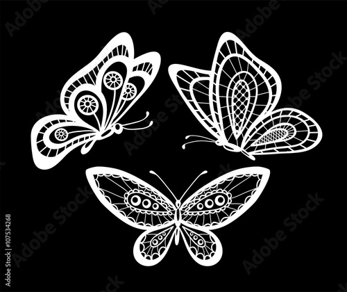 set of beautiful black and white guipure lace butterflies isolated.