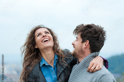 Pretty and inlove couple hugging, laughing and having a good time