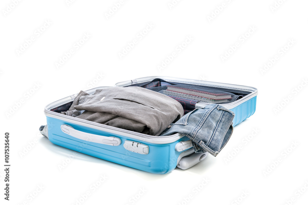 stack of clothes in open travel bag stack of clothes in open travel bag