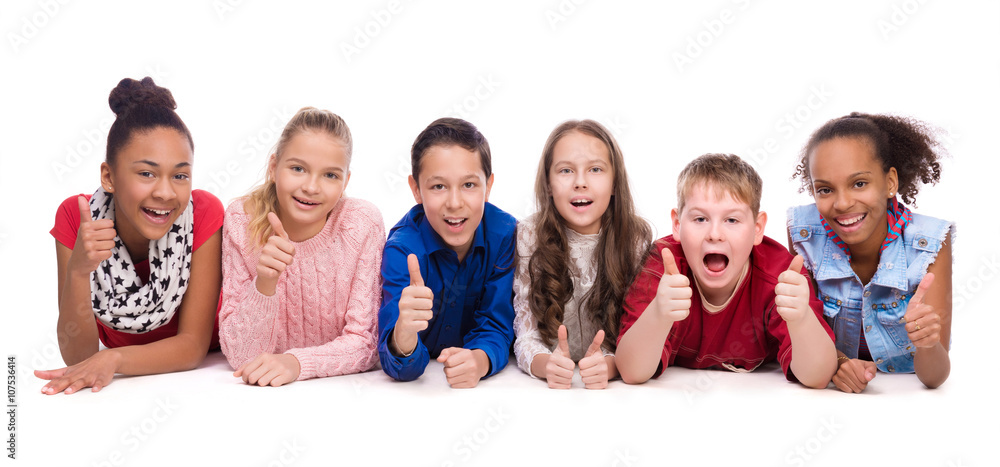 smiling children lying on the floor smiling children lying on the floor