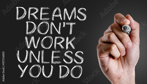 Фотография Hand writing the text: Dreams Don't Work Unless You Do