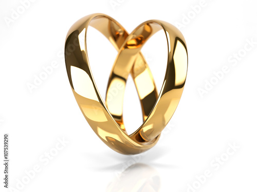 Heart made from wedding rings. Isolated on white.