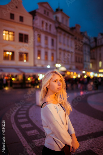 Beautful happy tourist blonde woman posing in evening Prague str © pyrozenko13