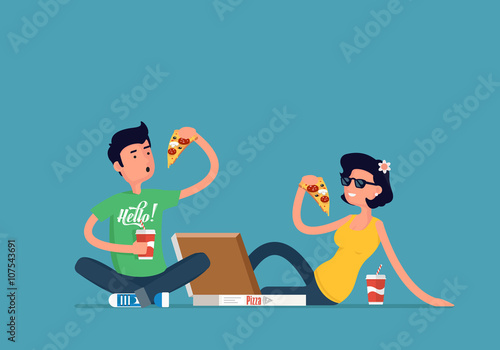 boy and girl sitting on the floor and eating pizza