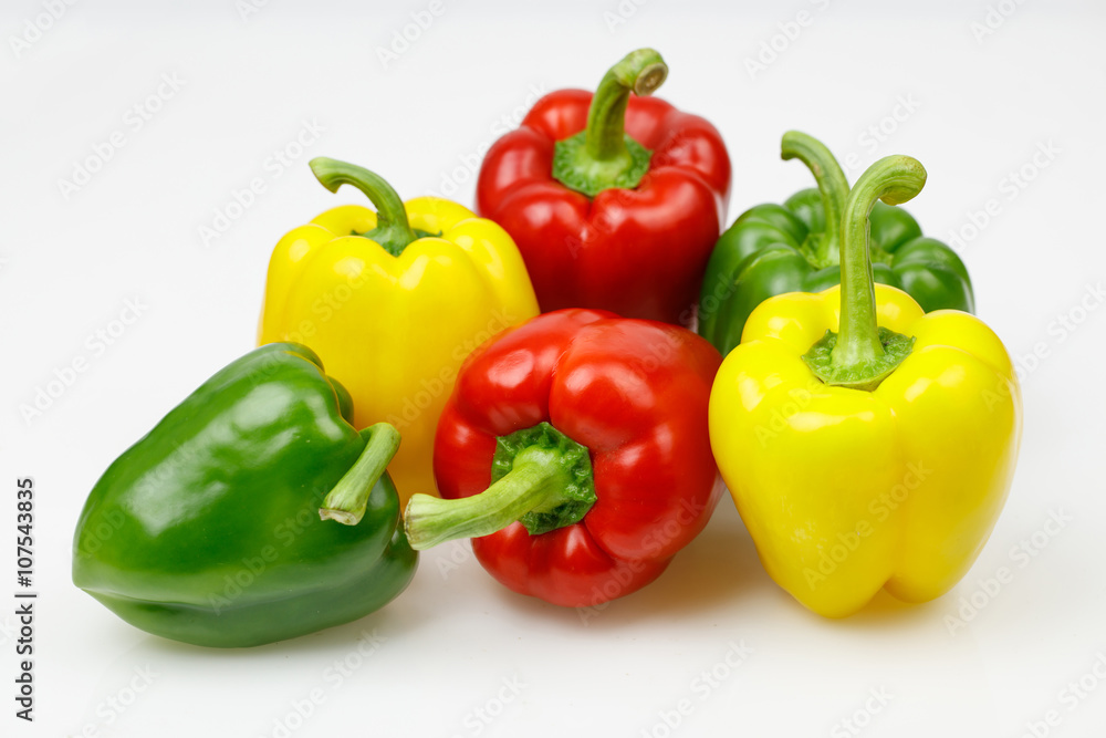 Colorful bell peppers, on white background. Colorful bell peppers, on white background.