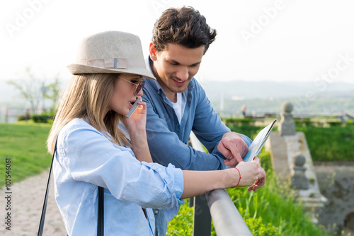 Tourists looking at city map © Stock Rocket
