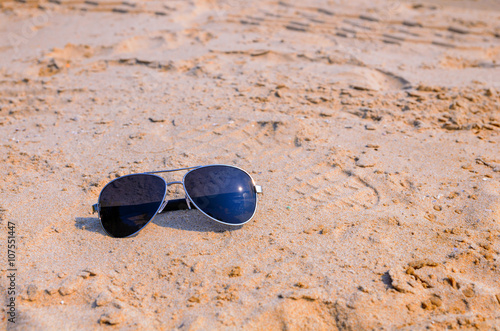 Sunglasses on the sea beach