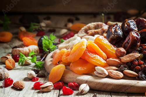 Dried apricots, set of nuts and dried fruits, vintage wooden bac