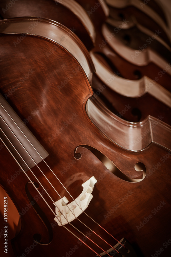 Obraz premium Group of cellos in the workshop violin maker