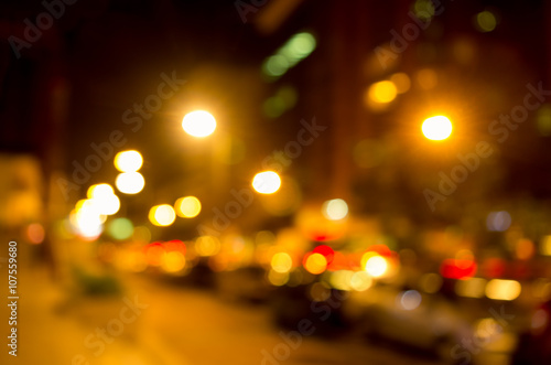Blurry yellow evening lights as seen through abstract artistic point of view in traffic