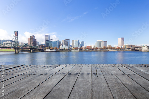 empty wood floor with cityscape and skyline in portland © zhu difeng