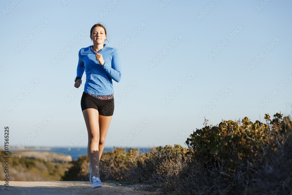 Sport runner jogging on beach working out Sport runner jogging on beach working out