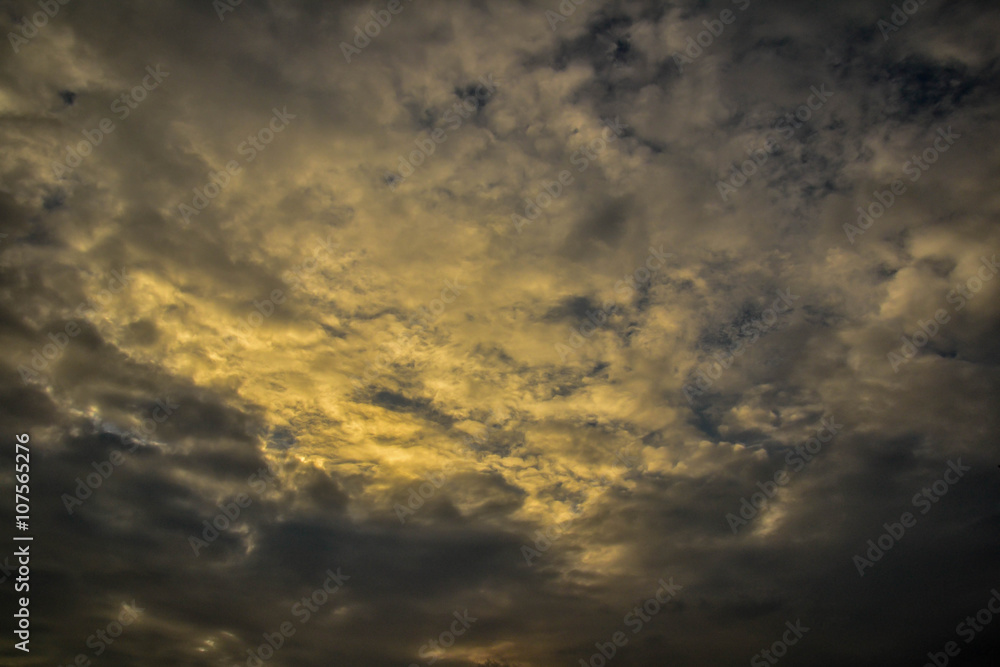 Dark clouds with yellow light photo