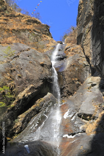 Waterfall in valley of Bhutan © Rudolf Tepfenhart