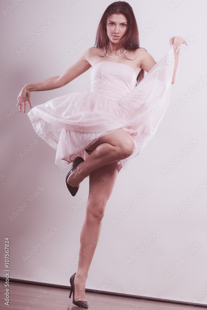 woman in bright dress and high heels shoes dancing woman in bright dress and high heels shoes dancing