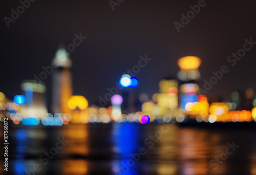 Background of night city skyline reflected in water © efired