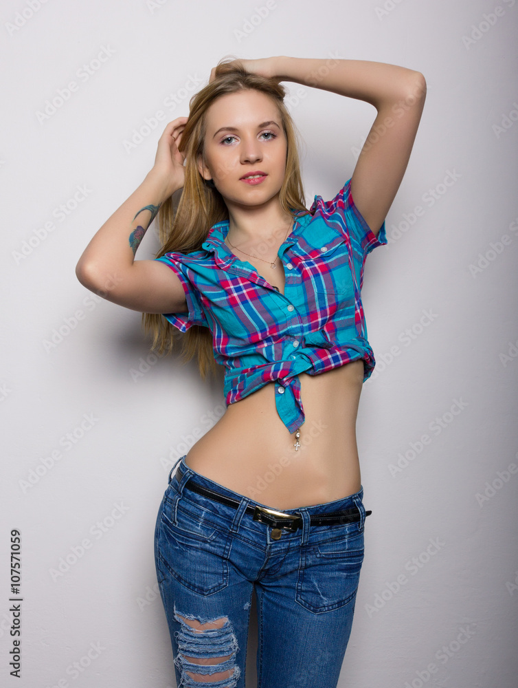 close-up portrait of sexy young girl in jeans and a plaid shirt Stock Photo  | Adobe Stock