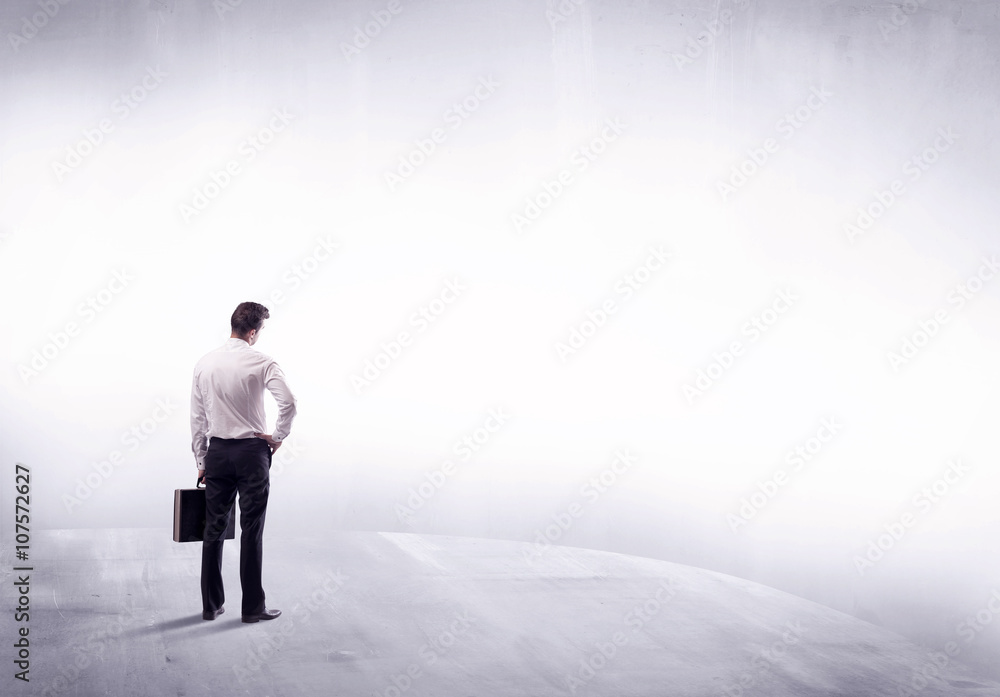 Business person standing from rear view Business person standing from rear view