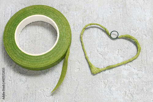 Florist at work: steps of making viola odorata (violets) wreath