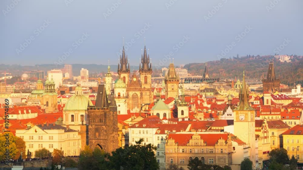 Czech Republic. Cloudless weather. Day turns into night over the roofs of Prague. Night lights landmarks replaces sunlight gradually. Time lapse 4K Czech Republic. Cloudless weather. Day turns into night over the roofs of Prague. Night lights landmarks replaces sunlight gradually. Time lapse 4K
