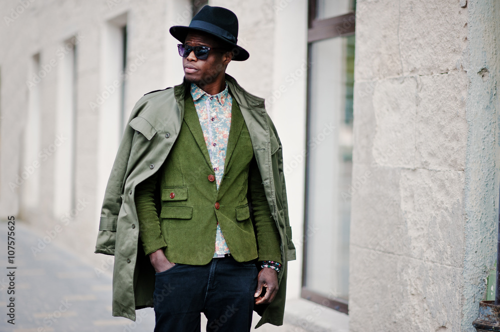 Naklejka premium Fashion portrait of black african american man on green velvet j